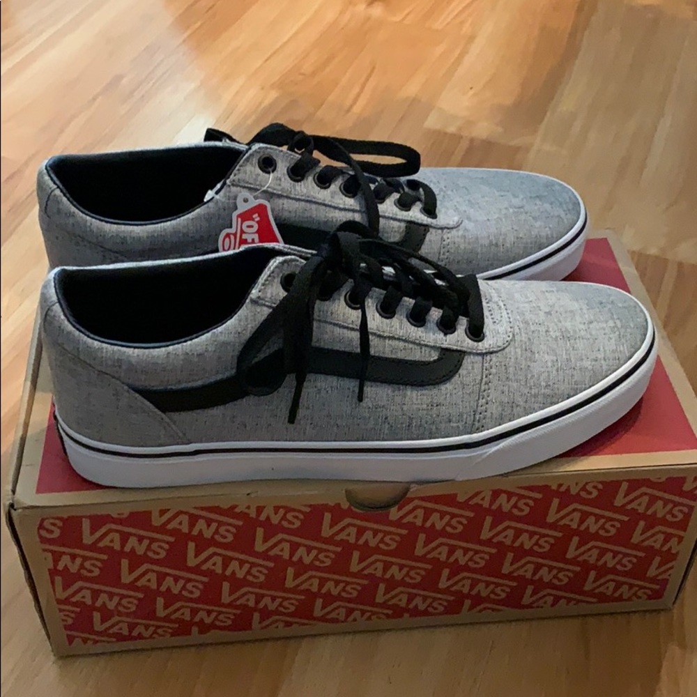 Gray/white/black Vans.